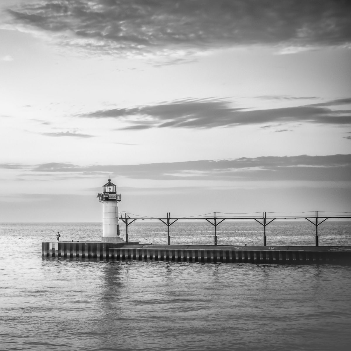 St. Joseph lighthouse and angler, black and white