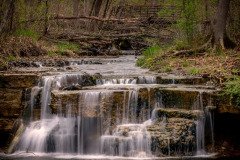 Caron Falls flowing over rock ledges in Northfield, Minnesota