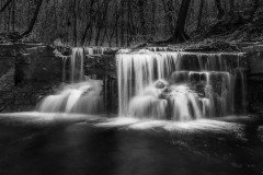 Caron Falls flowing through the woods